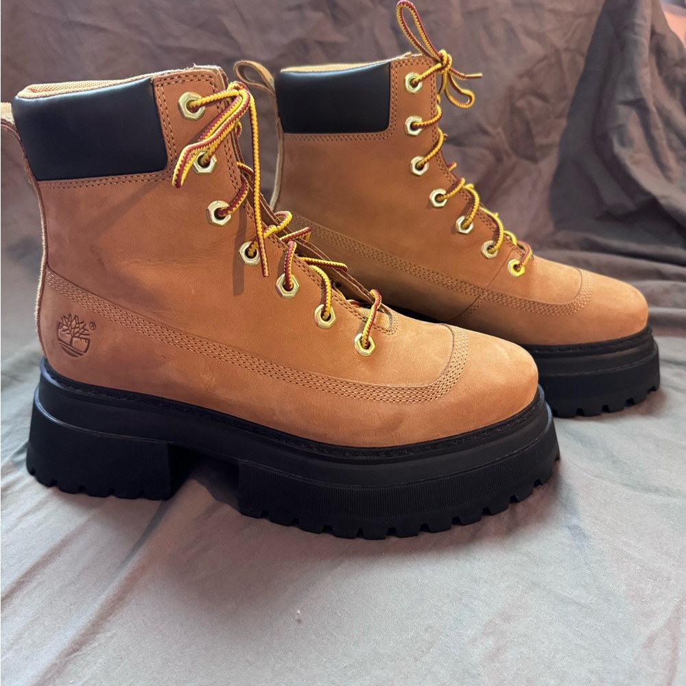 Tan Leather Hiking Boots with Black Soles Brand is Timberland